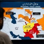 A newsroom analyst views a large digital screen displaying a map of Central and South Asia. Afghanistan is highlighted in yellow, Pakistan in red, and neighboring countries in orange. Arrows indicate tensions radiating from Afghanistan. Several bilingual (Urdu/English) text boxes highlight regional security and diplomatic threats, including ISIS-K and TTP, under the title 'Regional Trust Crisis'.