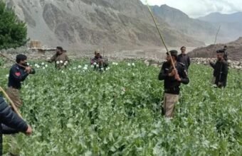 Security forces and police vehicles deployed in Chilas, Gilgit-Baltistan, following an armed attack on a police team during an opium eradication operation, branded by The Khyber Times.