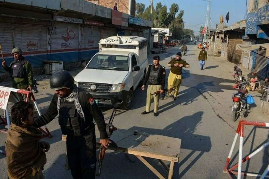 "Khyber Pakhtunkhwa police vehicle and security forces stationed following an ambush in DI Khan."
