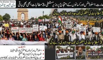 A detailed news infographic by The Khyber Times about Indian protests. At the top, Urdu text reads: "India: Protests by Students and Farmers, Minister Resigns, 3 Demands Still Pending." The main image is a split-screen photo of massive protest rallies in New Delhi near India Gate. The left side features young people with signs that say "JNU PROTESTS," "STUDENT POWER," and "انقلاب زندہ باد" (Long Live the Revolution). The right side shows farmers in turbans and beards with signs reading "KISAN UNITY" and "JUSTICE FOR FARMERS." Overlaid Urdu text in the center and bottom says: "The struggle will continue until the 3 demands are met." The bottom section includes a summary in Urdu under the heading "Key Points" and three smaller image insets. The insets show a "Resignation is Not Victory" sign, a dejected former minister, and a banner that lists "REPEAL, RELEASE, JUSTICE" in English and Urdu.