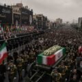 "Massive funeral procession for Ayatollah Ali Khamenei in Tehran, featuring thousands of mourners, international dignitaries, and heavy security presence."