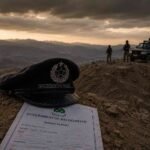 English: Balochistan Police cap on a rocky landscape, symbolizing the security inquiry in Ziarat.زیارت سکیورٹی انکوائری کی علامت کے طور پر چٹانی علاقے پر بلوچستان پولیس کی ٹوپی