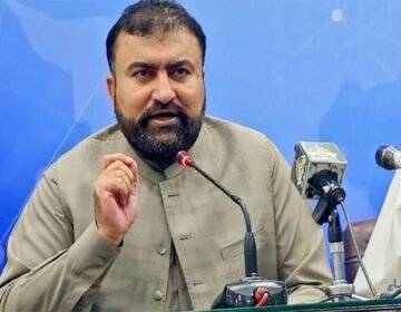 Balochistan Chief Minister Sarfraz Bugti speaking at the 20th National Workshop in Quetta, addressing peace talks within the Constitution of Pakistan, branded by The Khyber Times.