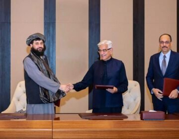 Pakistani Defence Minister Khawaja Asif shaking hands with Afghan Acting Defence Minister Mullah Mohammad Yaqoob during high-level bilateral security talks