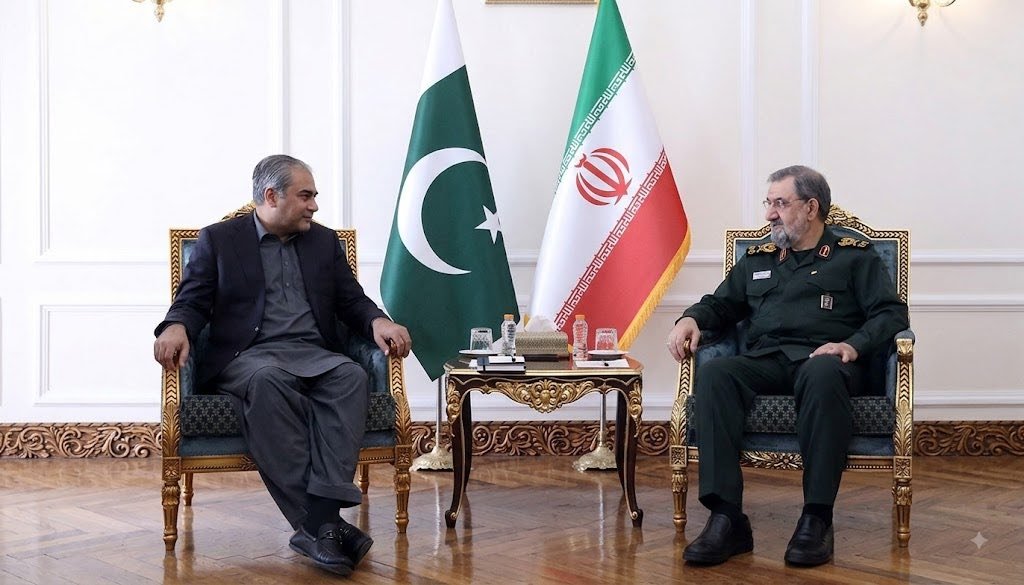 Pakistan Interior Minister Mohsin Naqvi meeting Iranian SNSC Secretary Mohsin Rezaei in Tehran with Pakistani and Iranian flags in the background