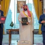 Turkish President Erdogan, Saudi Crown Prince MBS, and PM Shehbaz Sharif holding signed Pakistan Saudi Turkey defense agreement documents.