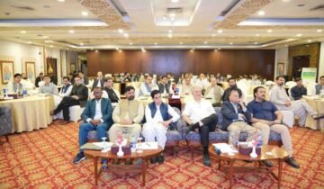 Health officials, journalists, and stakeholders seated in a conference hall during a polio awareness and eradication workshop.