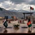 Pakistan-Afghanistan border crossing point with a negotiating table.
