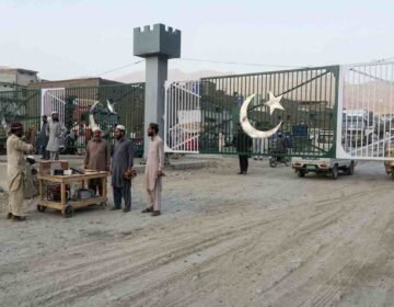 Closed main border gate and local individuals at the Pak-Afghan Torkham border