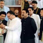 KP Health Minister Khaliq-ur-Rehman administering polio drops to a child to inaugurate the anti-polio campaign at Services Hospital, Peshawar.