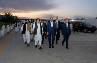 Turkish Intelligence Chief Ibrahim Kalin and Turkish delegates walking on the Kabul airport tarmac alongside Afghan Taliban officials.