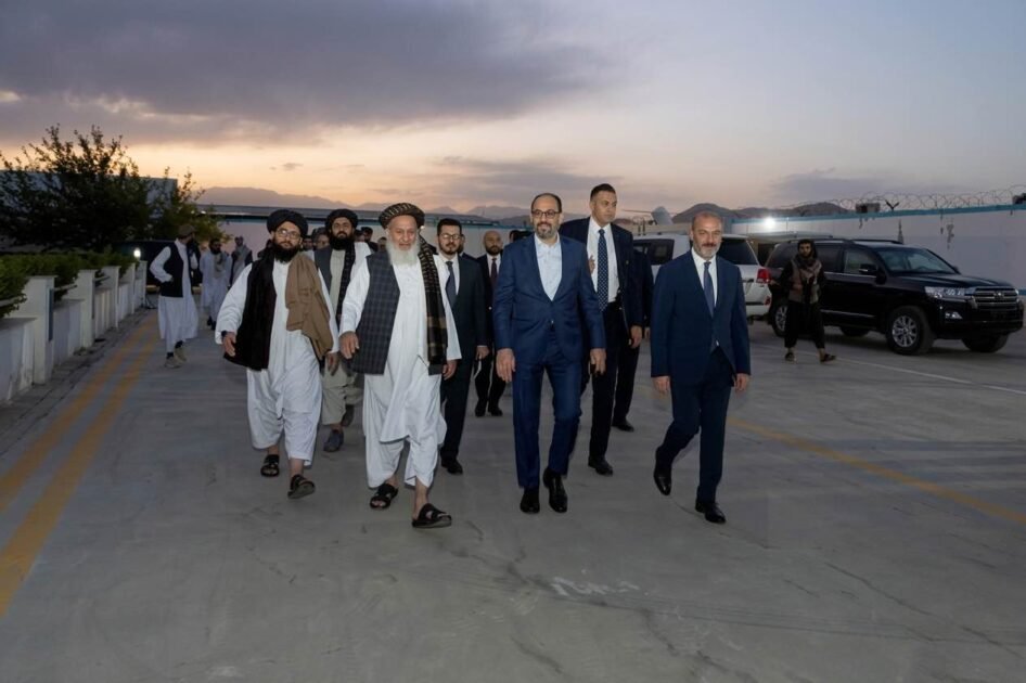 Turkish Intelligence Chief Ibrahim Kalin and Turkish delegates walking on the Kabul airport tarmac alongside Afghan Taliban officials.