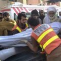 Rescue 1122 personnel and local residents carrying out relief operations following the attack on a traffic police mobile in Tank.