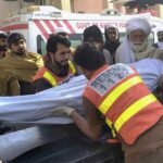 Rescue 1122 personnel and local residents carrying out relief operations following the attack on a traffic police mobile in Tank.