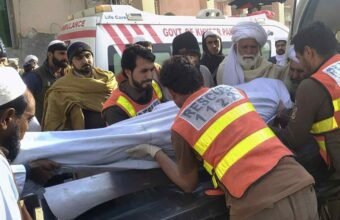 Rescue 1122 personnel and local residents carrying out relief operations following the attack on a traffic police mobile in Tank.