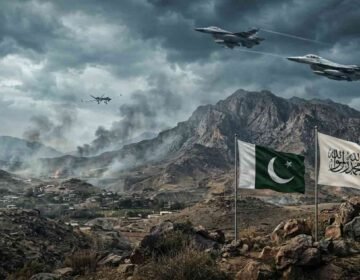 Photojournalistic image of geopolitical tension on the Pakistan-Afghanistan border. The background shows smoke rising from mountain villages amid an overcast sky. In the foreground, the Pakistani flag and the white Islamic Emirate of Afghanistan flag wave side-by-side on flagpoles. Military jets and a surveillance drone are visible in the sky.